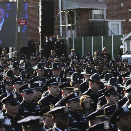 Cops turn backs on de Blasio at executed officer's funeral