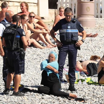 French politicians want to sue people for sharing photos of police making women take off burkinis