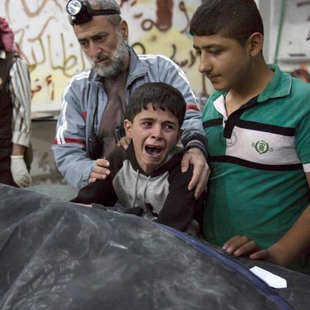 Video shows Syrian boy weeping over body of brother killed in bombing