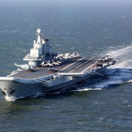 China defies world and sails aircraft carrier through 'forbidden' sea