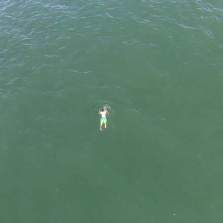 Drone video released of man swimming from Surf City Police