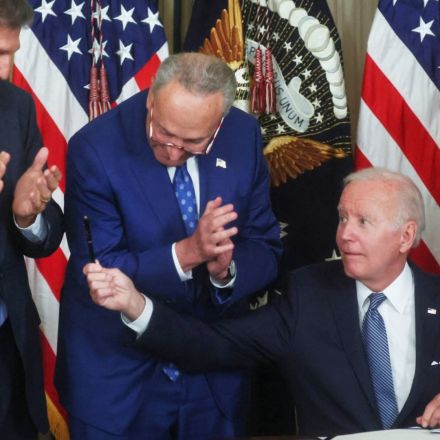 Biden signs Inflation Reduction Act into law, setting 15% minimum corporate tax rate