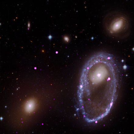 Galaxy Punches Through Neighbor to Spawn Giant Ring of Black Holes