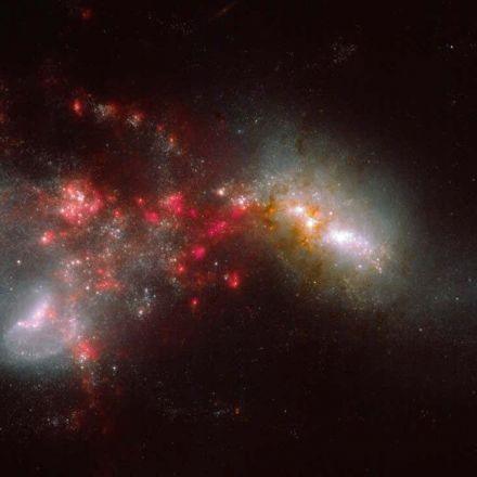 JWST has caught two galaxies smashing together and sparking starbursts