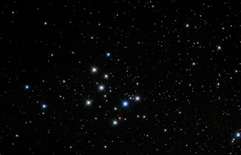 M29 is both very young - 10 million years old - and very close - about 4000 light years distant.  It's also rather small in quantity, with about 50 stars. <br />
<br />
Image credit:www.mistisoftware.com