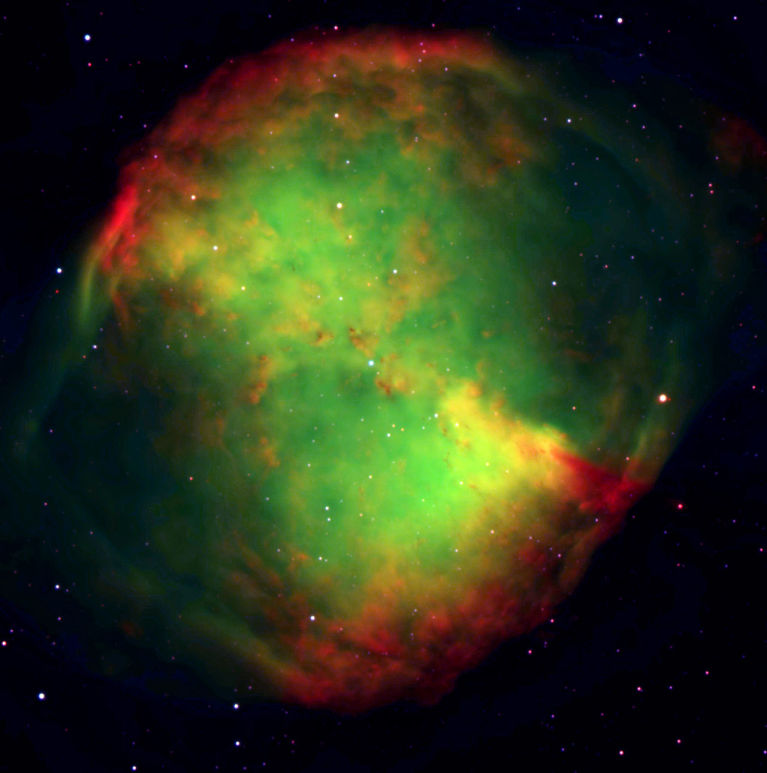 Three color composite image. The bright green glow is from doubly ionized oxygen atoms. M27 is a binary system. The central star is an extremely hot bluish subdwarf star. <br />
<br />
Image credit: ESO<br />
