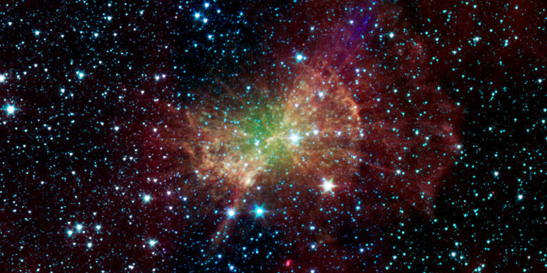 Infrared view of M27. The green is the superheated double-ionized oxygen atoms while the red represents hydrogen. <br />
<br />
Image credit: NASA/JPL-Caltech/J. Hora (Harvard-Smithsonian CfA), of the Spitzer Space Telescope’s Infrared Array Camera<br />
