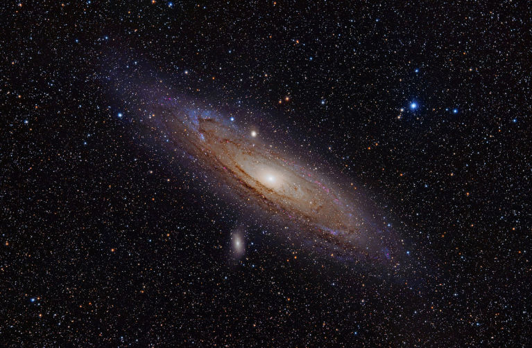 M32 just below its much larger neighbor, M31.<br />
<br />
Image credit: Adam Evans - M31, the Andromeda Galaxy (now with h-alpha)Uploaded by NotFromUtrecht, CC BY 2.0, https://commons.wikimedia.org/w/index.php?curid=12654493