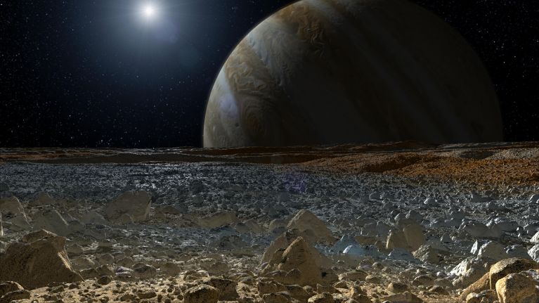 This artist’s concept shows a simulated view from the surface of Jupiter’s moon Europa.