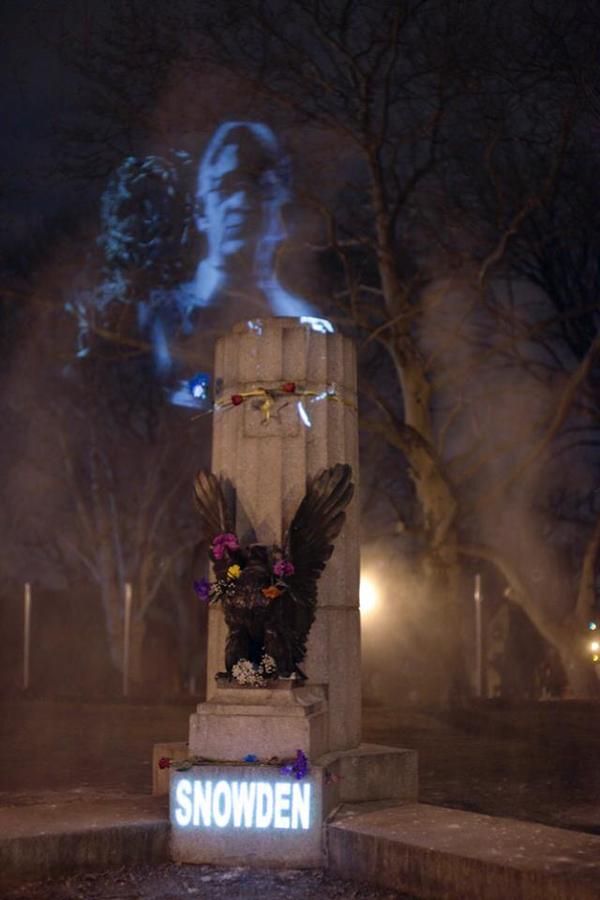 The Illuminator Art Collective combined two projectors and a cloud of smoke in order to display Snowden's likeness atop a Revolutionary War memorial while the morning sky was still dim in Brooklyn's Fort Greene Park. 